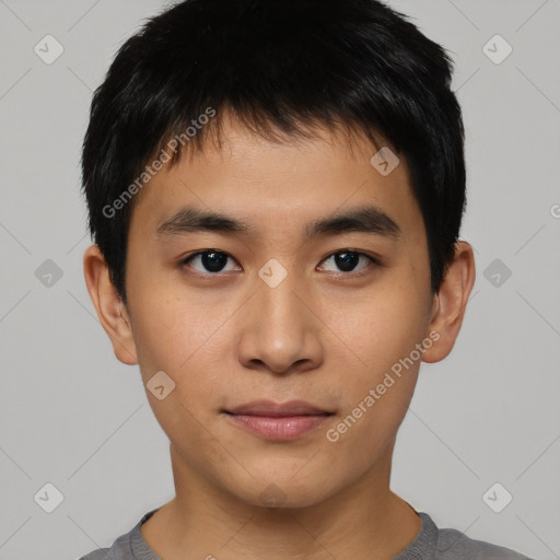 Joyful asian young-adult male with short  brown hair and brown eyes