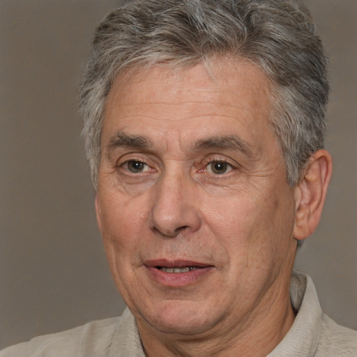 Joyful white middle-aged male with short  gray hair and brown eyes