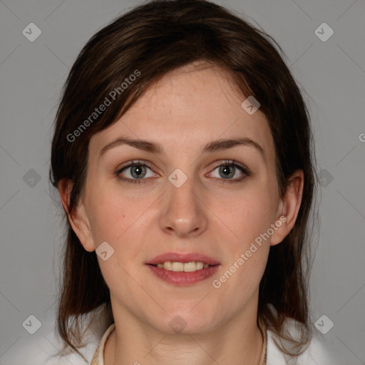 Joyful white young-adult female with medium  brown hair and grey eyes