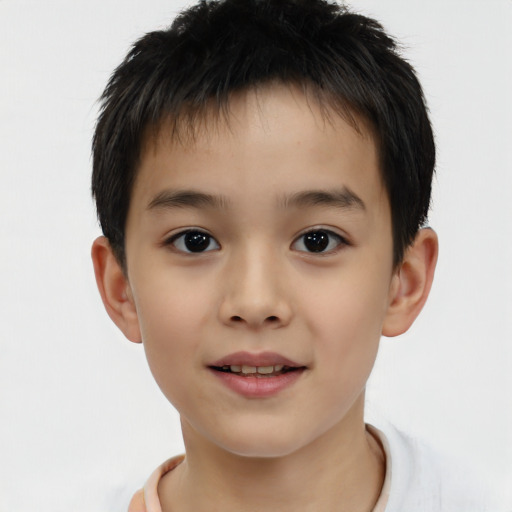 Joyful white child male with short  brown hair and brown eyes