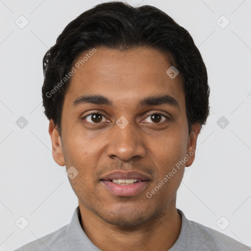 Joyful latino young-adult male with short  black hair and brown eyes