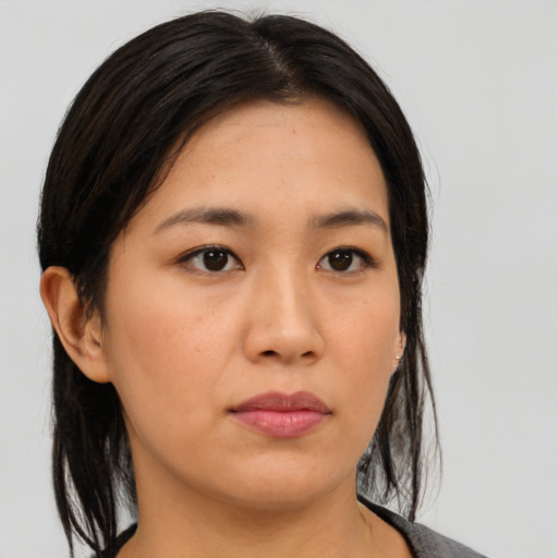 Neutral asian young-adult female with medium  brown hair and brown eyes