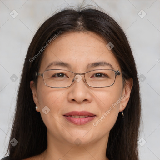 Joyful white adult female with medium  brown hair and brown eyes