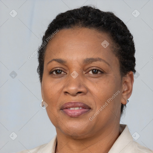 Joyful black adult female with short  brown hair and brown eyes