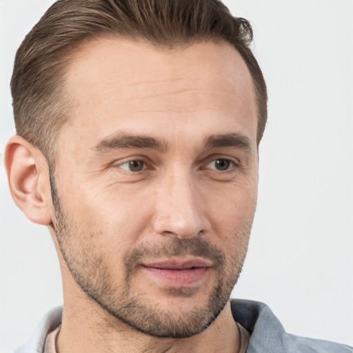 Joyful white adult male with short  brown hair and brown eyes