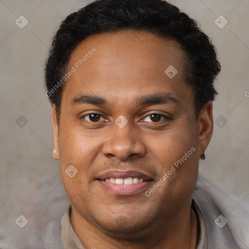 Joyful latino young-adult male with short  brown hair and brown eyes