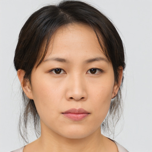 Neutral asian young-adult female with medium  brown hair and brown eyes