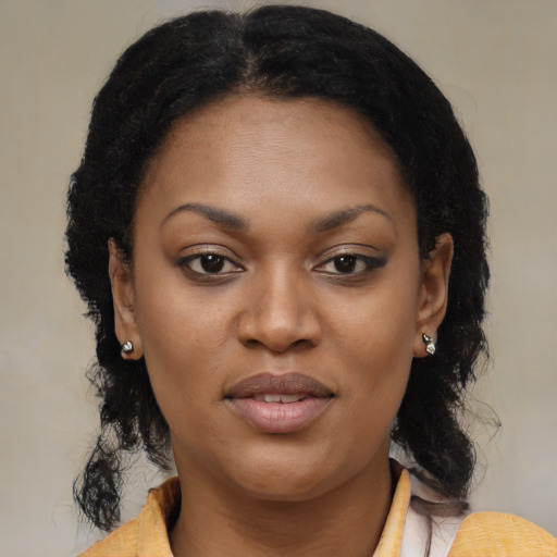Joyful black young-adult female with medium  brown hair and brown eyes
