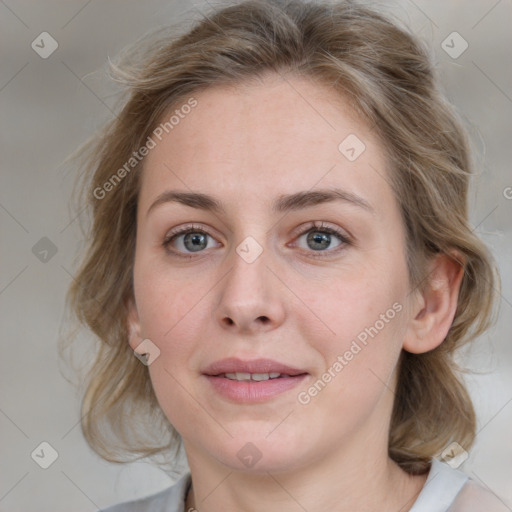 Joyful white young-adult female with medium  brown hair and blue eyes