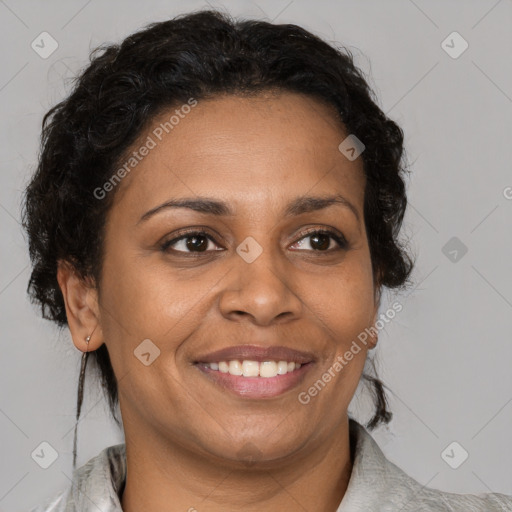 Joyful black adult female with medium  brown hair and brown eyes