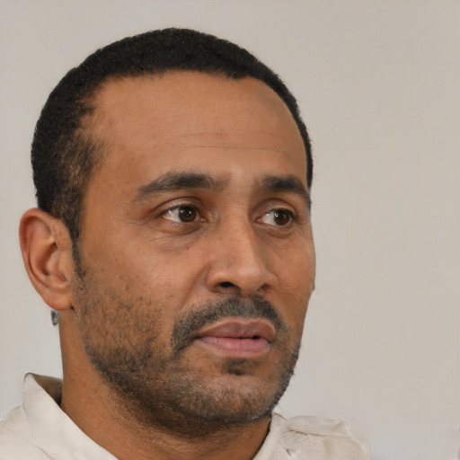 Neutral latino adult male with short  black hair and brown eyes