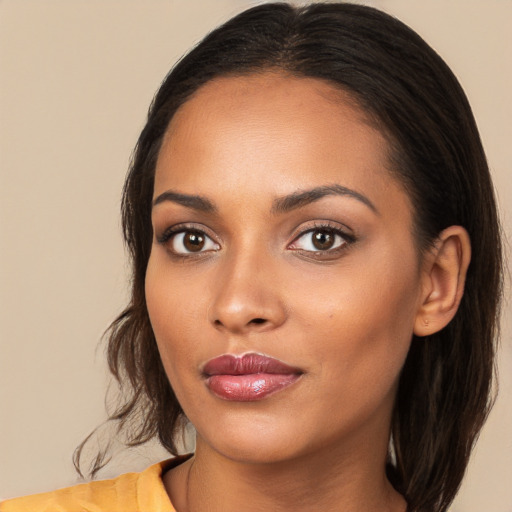 Neutral white young-adult female with long  brown hair and brown eyes