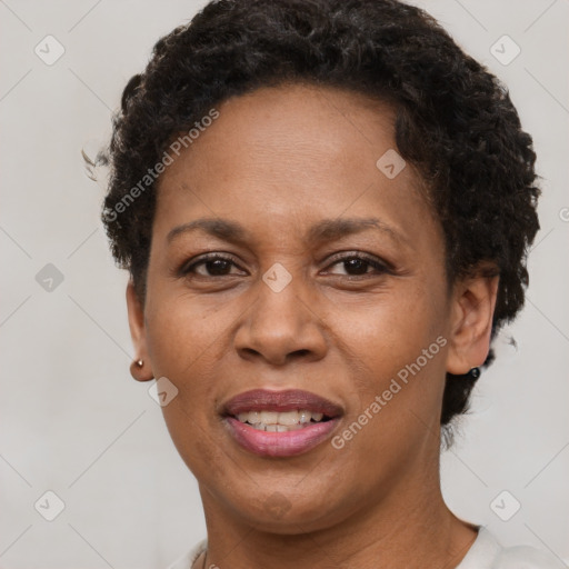 Joyful black adult female with short  brown hair and brown eyes