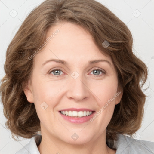 Joyful white adult female with medium  brown hair and green eyes