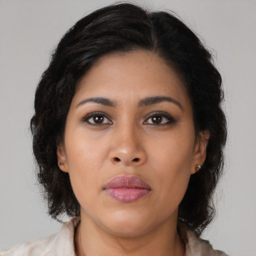 Neutral latino young-adult female with medium  brown hair and brown eyes