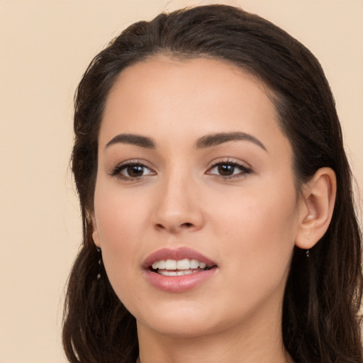 Joyful white young-adult female with long  brown hair and brown eyes