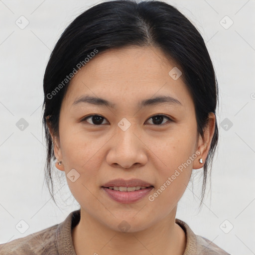 Joyful asian young-adult female with medium  brown hair and brown eyes