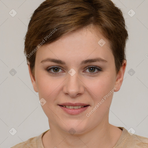 Joyful white young-adult female with short  brown hair and grey eyes