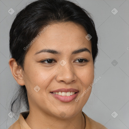 Joyful latino young-adult female with medium  brown hair and brown eyes