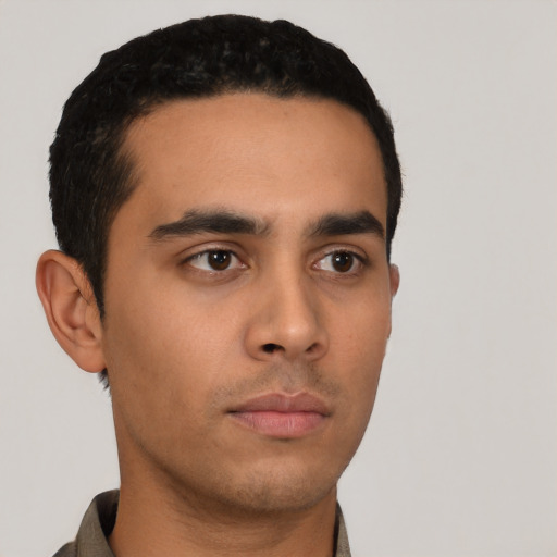 Neutral latino young-adult male with short  black hair and brown eyes