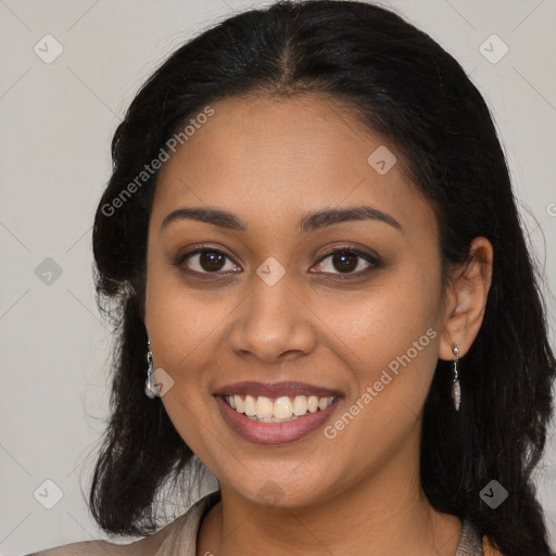 Joyful latino young-adult female with long  black hair and brown eyes