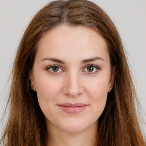 Joyful white young-adult female with long  brown hair and brown eyes