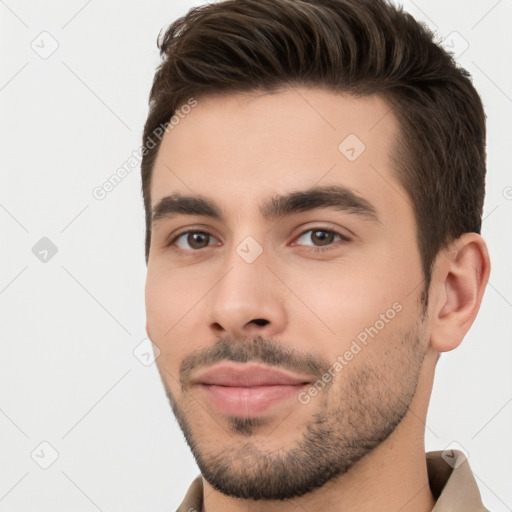 Joyful white young-adult male with short  brown hair and brown eyes