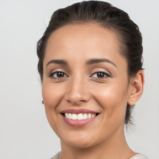 Joyful white young-adult female with medium  brown hair and brown eyes