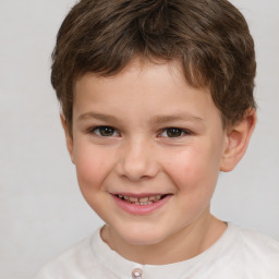 Joyful white child male with short  brown hair and brown eyes