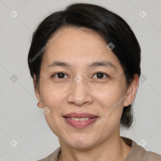 Joyful white adult female with medium  brown hair and brown eyes