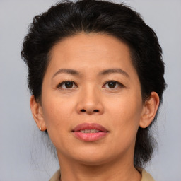 Joyful asian adult female with short  brown hair and brown eyes