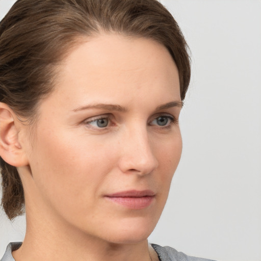 Neutral white young-adult female with medium  brown hair and grey eyes