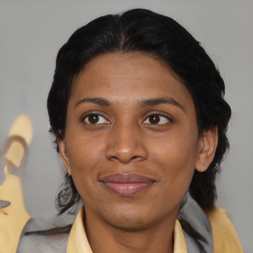 Joyful asian young-adult female with medium  black hair and brown eyes