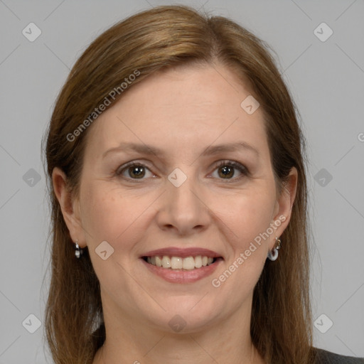 Joyful white adult female with medium  brown hair and grey eyes