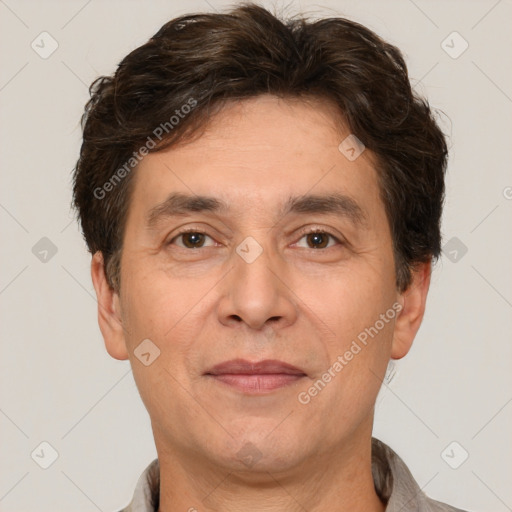 Joyful white adult male with short  brown hair and brown eyes