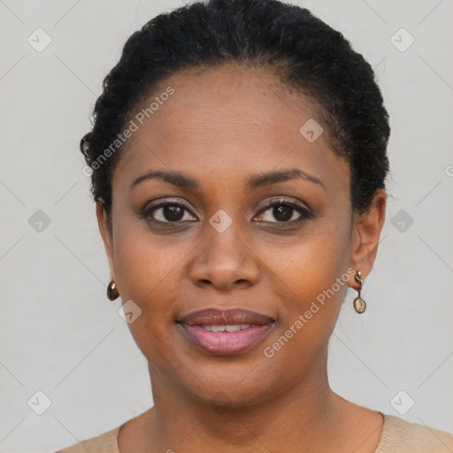 Joyful black young-adult female with short  black hair and brown eyes