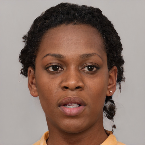 Neutral black young-adult female with short  brown hair and brown eyes