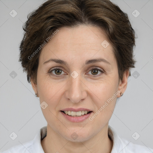 Joyful white adult female with short  brown hair and brown eyes