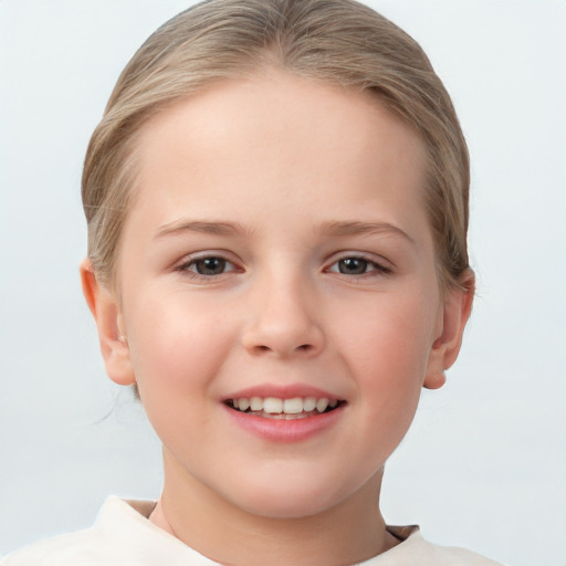 Joyful white child female with short  brown hair and brown eyes