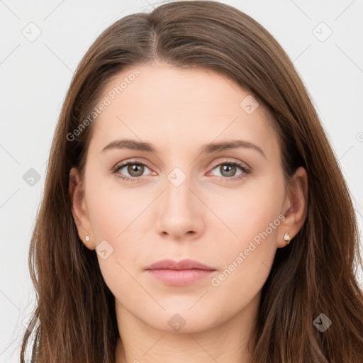 Neutral white young-adult female with long  brown hair and brown eyes