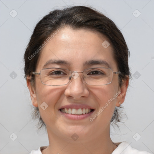 Joyful white adult female with medium  brown hair and brown eyes