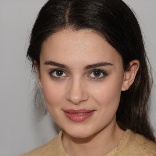 Joyful white young-adult female with medium  brown hair and brown eyes