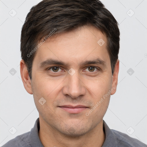 Joyful white adult male with short  brown hair and brown eyes