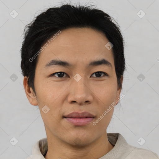 Joyful asian young-adult male with short  black hair and brown eyes