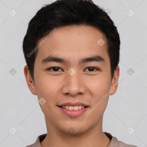 Joyful asian young-adult male with short  black hair and brown eyes