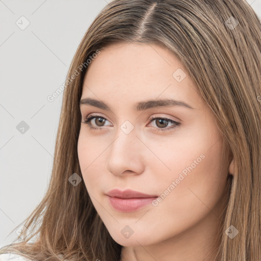 Neutral white young-adult female with long  brown hair and brown eyes