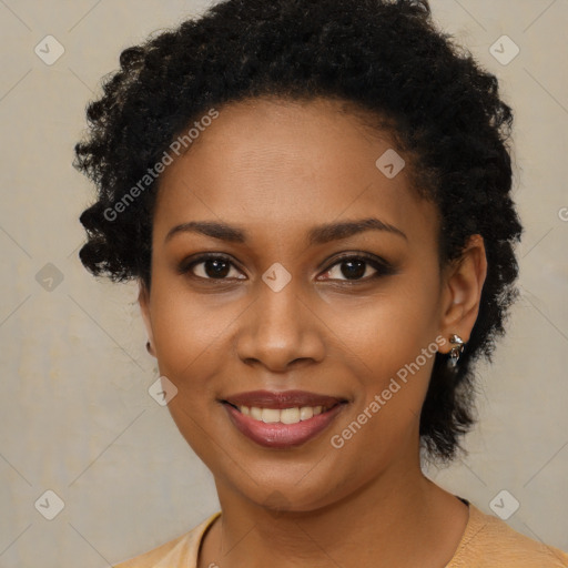 Joyful black young-adult female with short  black hair and brown eyes