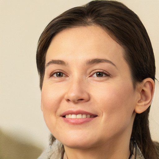 Joyful white young-adult female with medium  brown hair and brown eyes