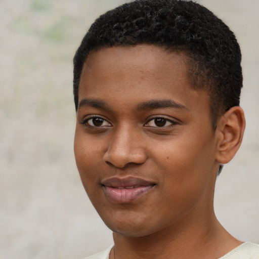 Joyful black young-adult male with short  brown hair and brown eyes