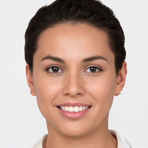 Joyful white young-adult female with short  brown hair and brown eyes